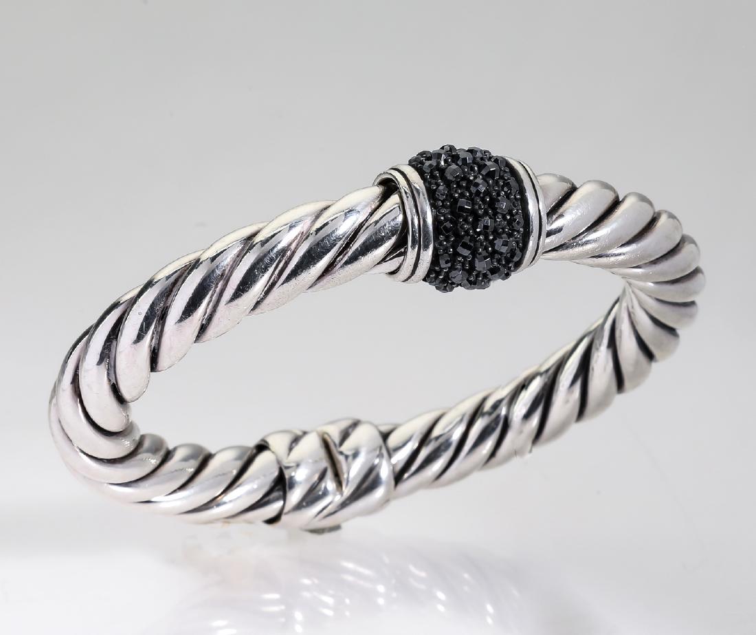 David Yurman sterling & hematite 'Osetra' bracelet: David Yurman sterling and hematite 'Osetra' hinged bracelet, the oval cable bracelet hinged at the center, having a bead clasp set with bands of (37) faceted round hematites, maker marked and stamped