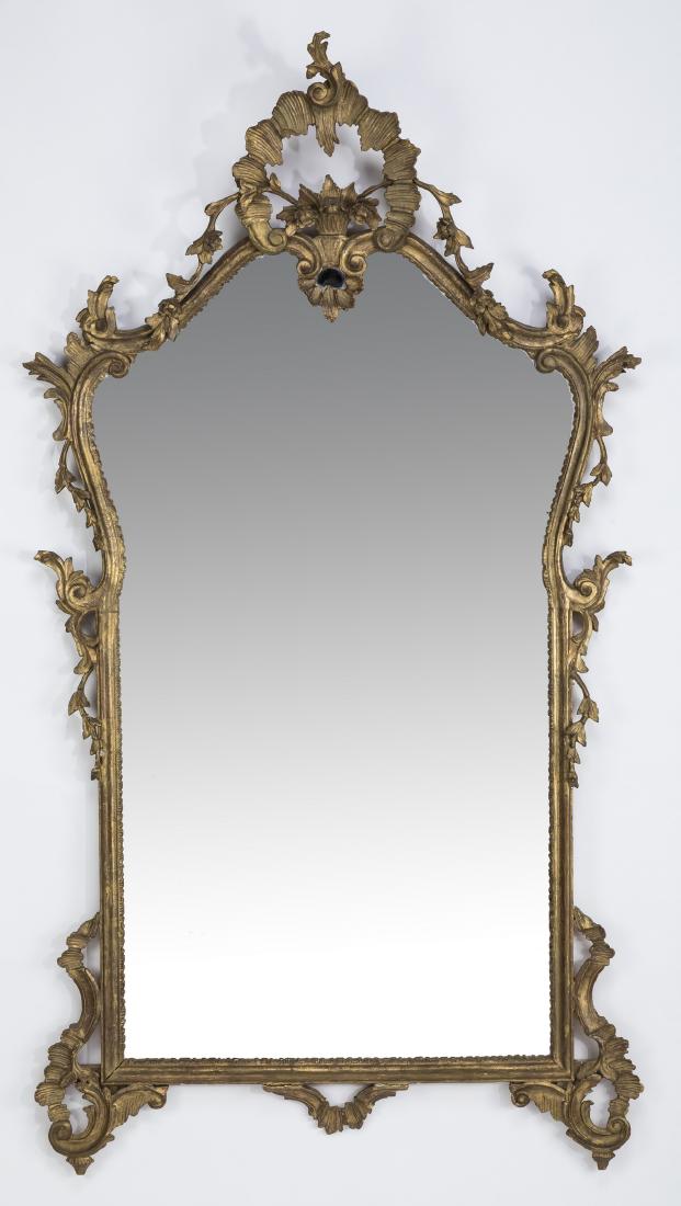 Early 20th c. Rococo style giltwood mirror, 66"h: Early 20th century Rococo style giltwood and gesso wall mirror, having a pierced circular cartouche crest with a scrolling vine along the top edge and sides, and scrolling acanthus motifs at the botto