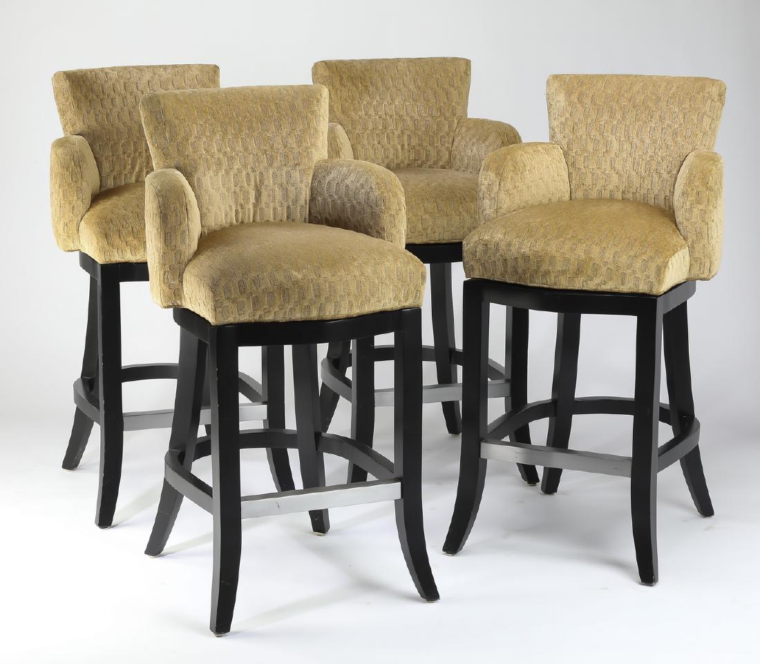 Group of (4) Beacon Hill upholstered swivel barstools: Group of (4) Beacon Hill swivel counter-height barstools, each having gold tone-on-tone geometric pattern upholstery, with an upholstered seat, back and arms, swiveling on four paint-decorated flared 