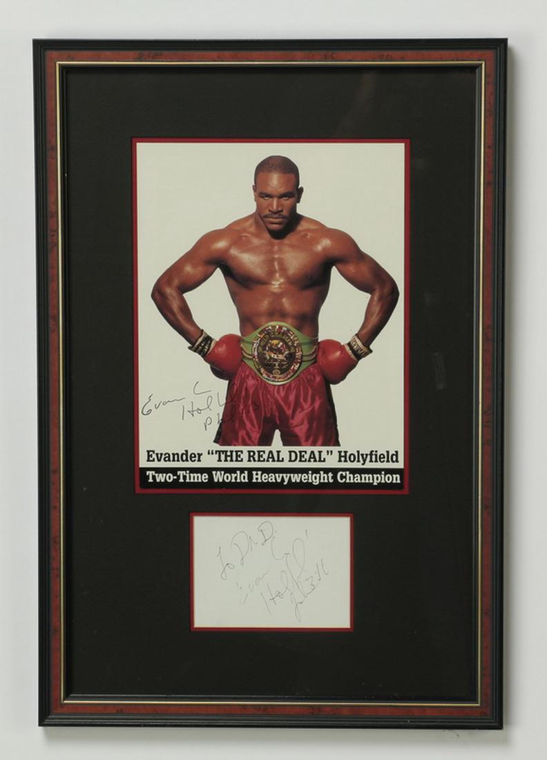 Framed autograph w/photo of Evander Holyfield: Autograph of heavyweight champion Evander Holyfield (American, born 1962) inscribed 'To Dad / Evander Holyfield / Jan 3:10,' framed and matted together with a signed color print, overall dimensions 22