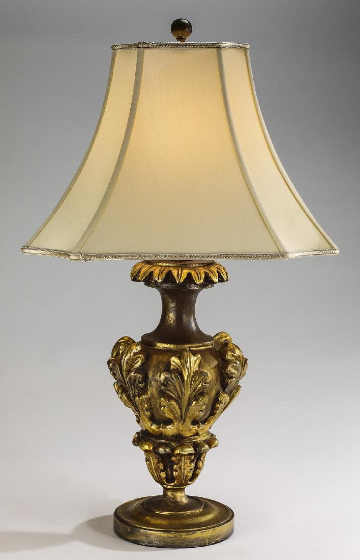 Gilt gesso acanthus urn table lamp, 30"h: Paint decorated urn form table lamp in the Rococo taste, executed in gilt gessoed wood, having a trumpet neck above a tapering body decorated with gold relief carved acanthus leaves, the whole rising 