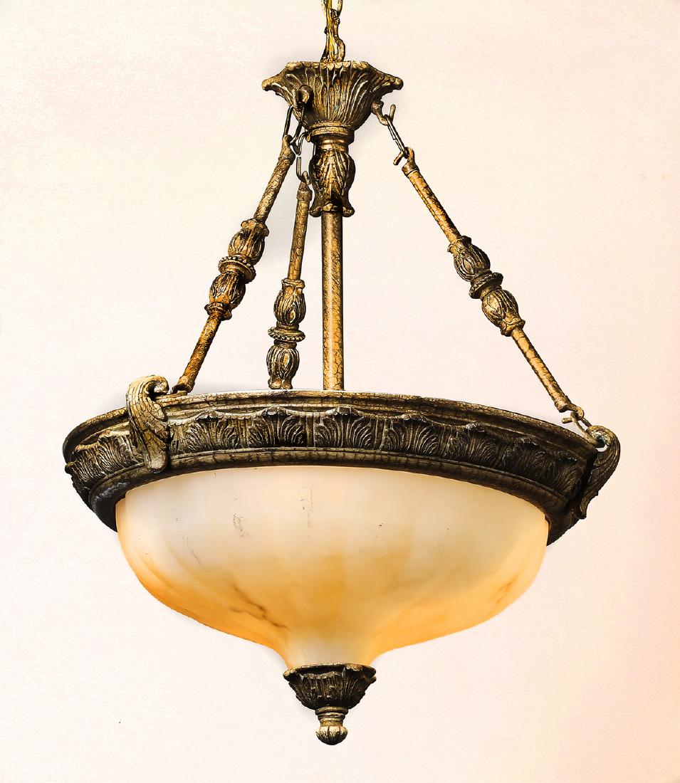 Empire style faux alabaster domed hanging light: Empire style faux alabaster domed hanging light, having a trumpet body dish, flanked by three chains with turned details, suspending the faux alabaster dome with a scalloped border, all above an acant
