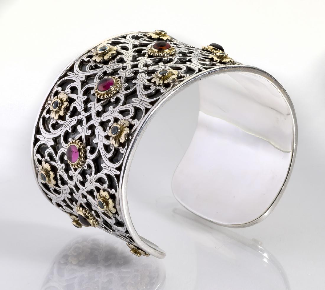 Konstantino sterling and 18k gem-set wide cuff: Konstantino wide sterling gem set cuff bracelet with 18k yellow gold accents from the 'Color Collection', having pierced Renaissance style filigree set with a center row of (7) gold bezel set pink tou