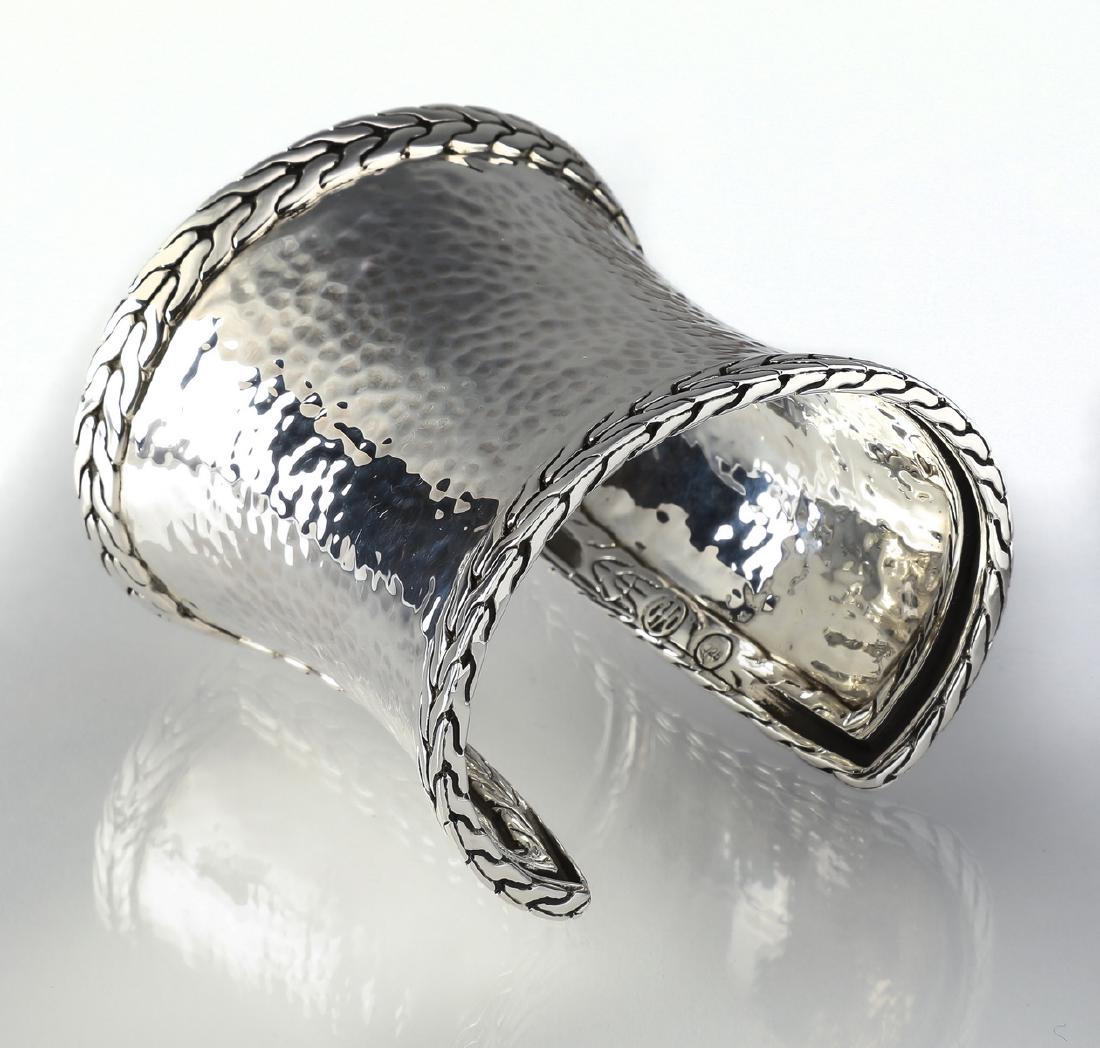 John Hardy sterling Palu cuff bracelet: John Hardy wide sterling silver Palu cuff bracelet, having a hammered body with applied chain edges, marked 925 and maker marked, 68mm or 2.5"wide, interior 6.25"; weighs 96 grams, with original John