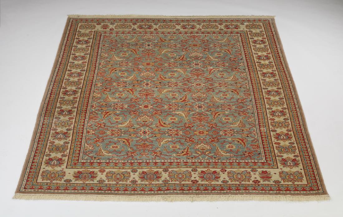 Turkish hand knotted wool carpet: Turkish hand knotted wool carpet, having an all over Herati design in tan and cream on a slate blue ground, with an alternating rosette border on a cream ground, 8' 5" x 6' 8".