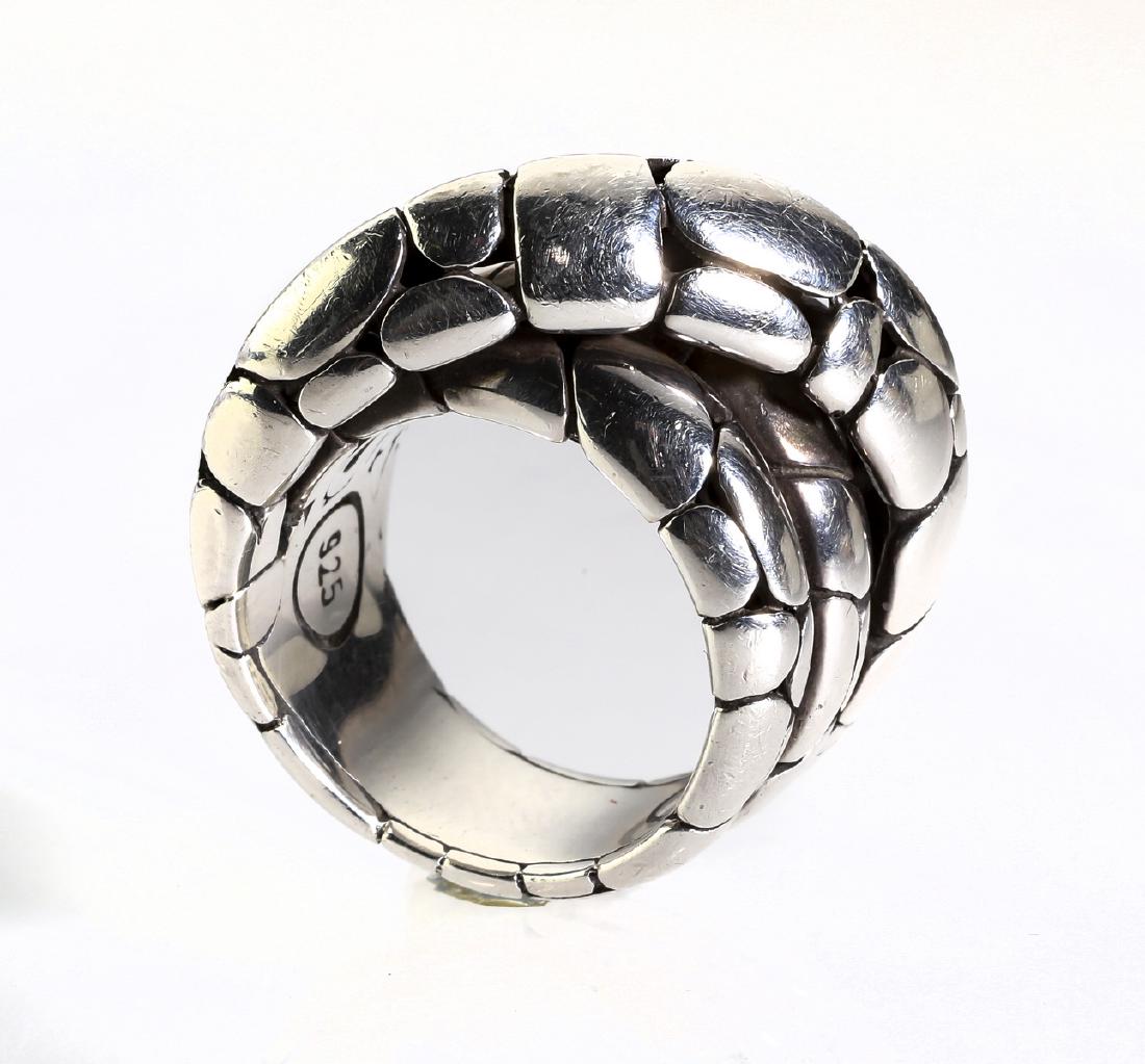 John Hardy 'Kali' sterling bypass ring: John Hardy 'Kali' bypass ring, executed in sterling silver with a pierced pebble texture, weighing 16.1 grams, marked 925 and maker marked, .50"w; size 7.5. Condition: Very good with little to no sign