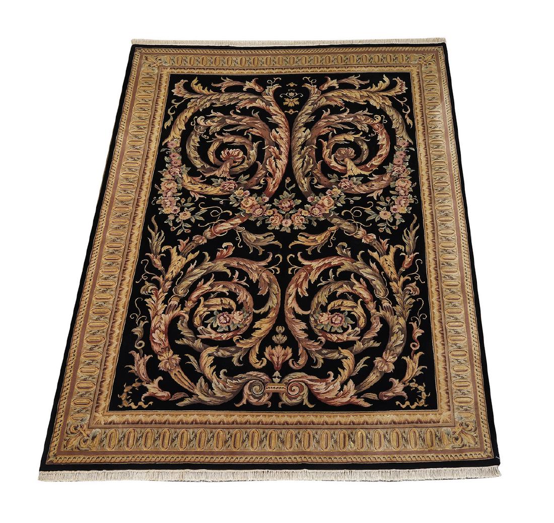 Sino-Aubusson hand knotted wool pile carpet, 12 x 9: Sino-Aubusson hand knotted wool pile carpet, having an all over design of acanthus scrollwork in pink and mauve intertwined rose garlands on a black ground, framed in Neo-classical style of repeating 