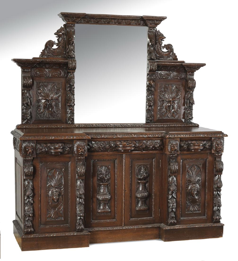 19th c. Italian carved oak sideboard, 72"l: Italian Renaissance Revival carved oak sideboard, late 19th century, having a stepped square cornice above a rectangular mirror flanked by carved lion masks, fruit and flower garlands, griffin 'C' scr