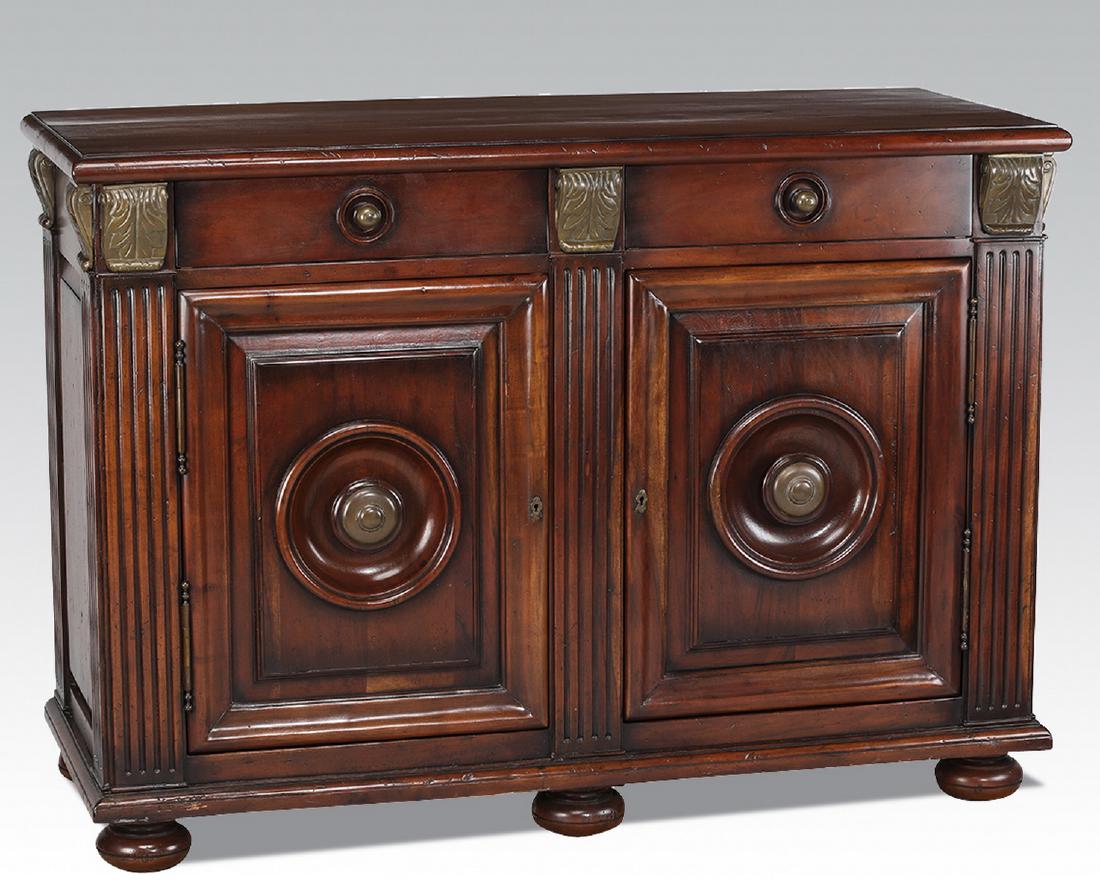 Empire style carved and gilt-decorated commode: Empire style mahogany commode, having two short drawers over two cabinet doors, opening to an inner shelf, all flanked by reeded stiles topped by gilt-decorated acanthus, terminating in six bun feet, 