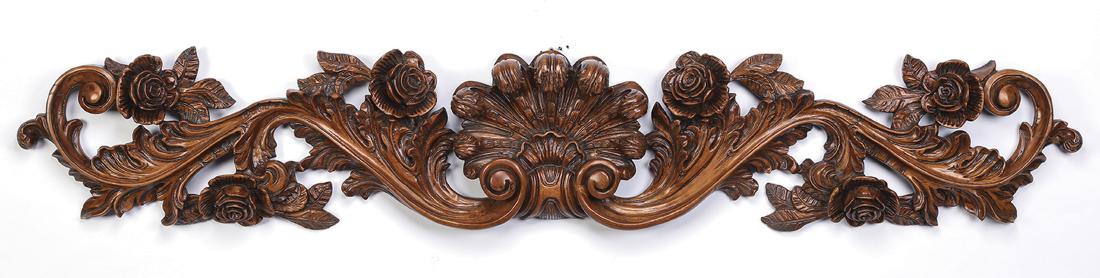 Baroque style carved architectural panel, 56"w: Baroque style carved architectural panel, having a central scallop cartouche flanked by acanthus scrollwork and rosettes, 9.5"h x 55.5"w x 4"d.