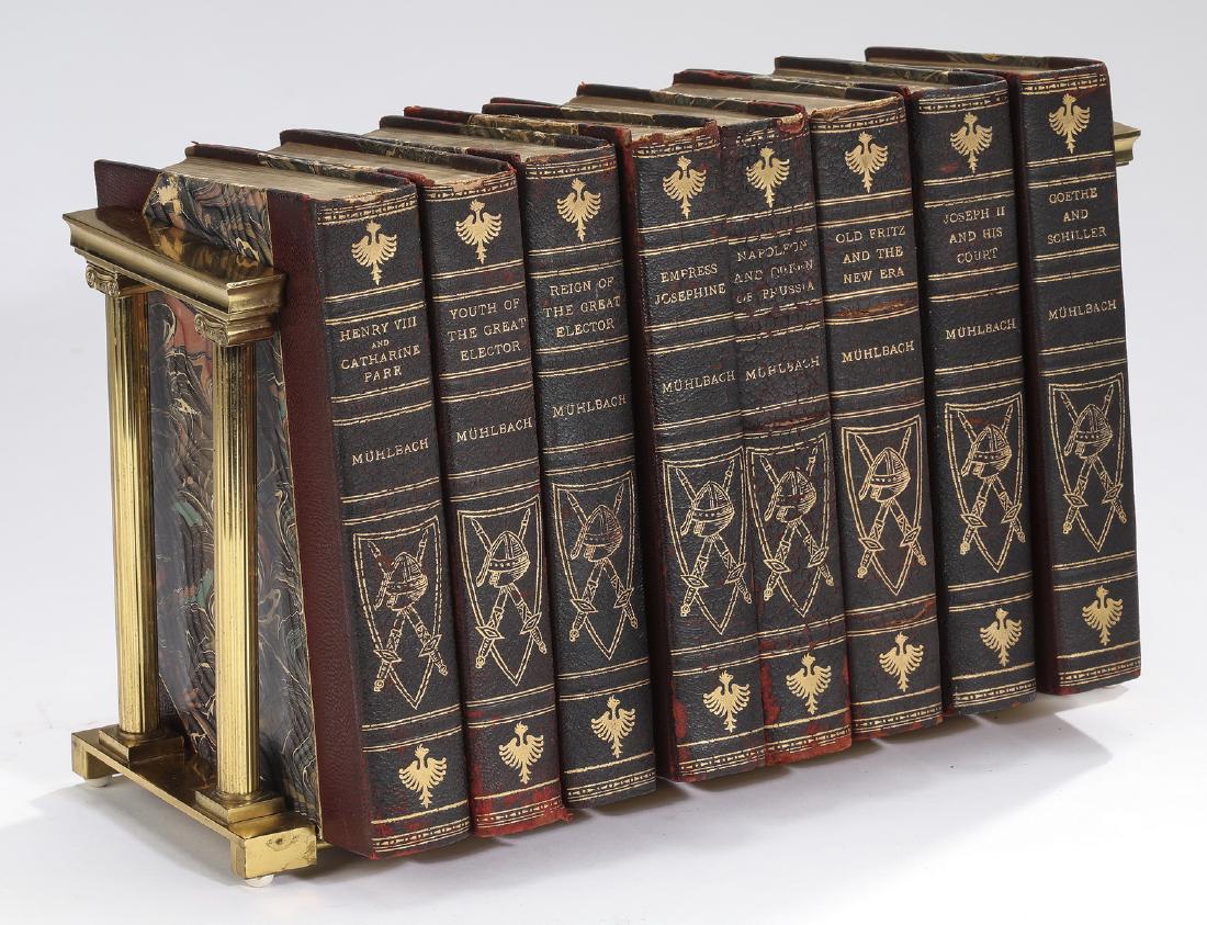 (8) Leather bound novels by Muhlback & brass rack: Eight leather bound historical novels by Luise Mühlbach, late 19th century, having leather spines and marbled end boards, including; The Youth of the Great Elector; The Age of the Great Elector, Empr