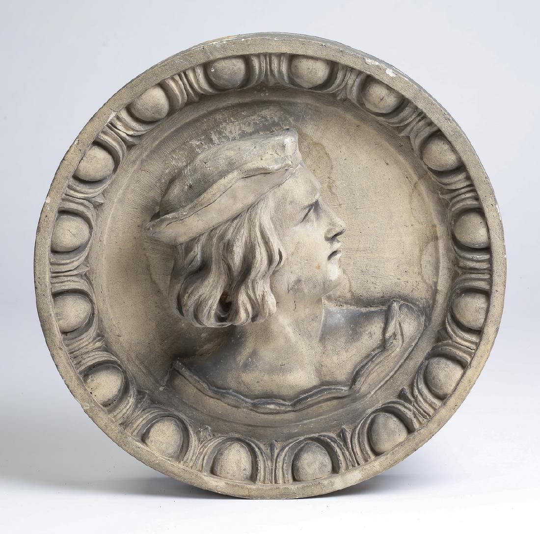 Renaissance style roundel with profile bust, 18.5"d: Cast stone roundel in the Renaissance style depicting a profile bust of a young man wearing a cap, surrounded by egg and dart molding, 18.5"dia x 8.5"d.