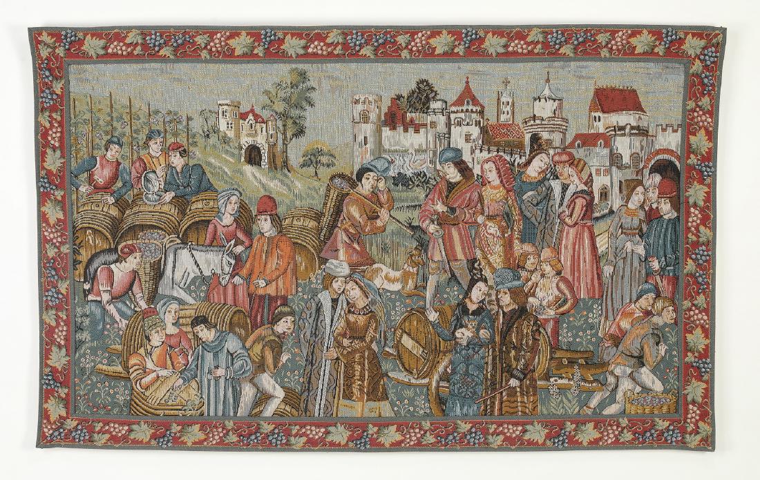 Flemish inspired 'Marche au Vin' woven tapestry: Flemish style woven tapestry titled 'Marche au Vin' or 'Wine Market,' depicting a bustling Medieval scene of merchants with grape hods and wine barrels amidst conversing courtly figures, with a castle