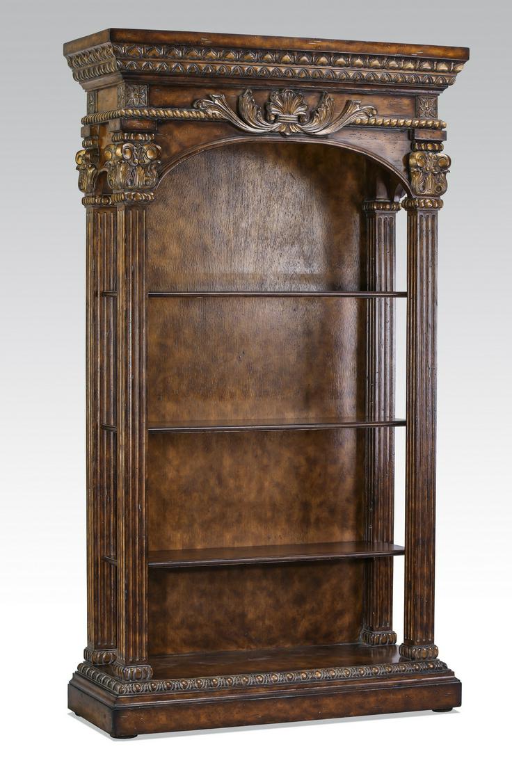 Neoclassical inspired parcel gilt burl wood bookcase: Neoclassical inspired parcel gilt burl wood bookcase, having a molded and parcel gilt cornice above the arched case, accented with an acanthus cartouche above the three shelves flanked by Corinthian c