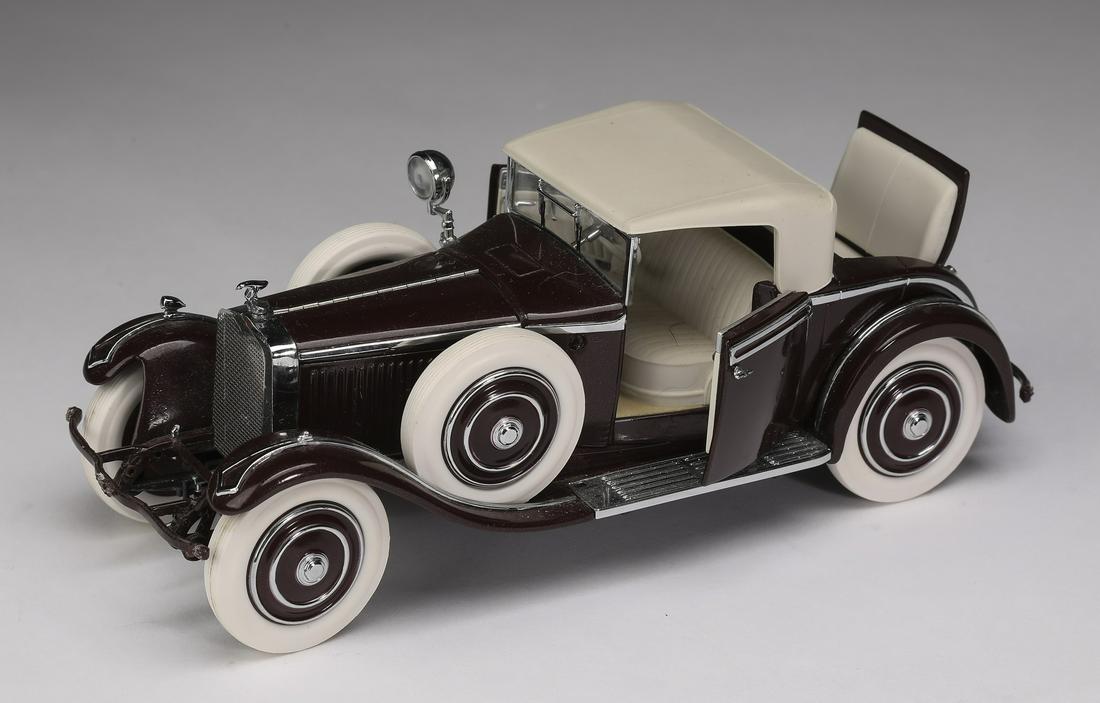 Franklin Mint 1925 maroon Hispano-Suiza Kellner H6B: Franklin Mint 1925 maroon Hispano-Suiza Kellner H6B, die-cast at 1:24 scale, marked, includes original tag, 3"h x 2.75"w x 8"d.