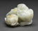 Chinese celadon jade boy atop lotus buds