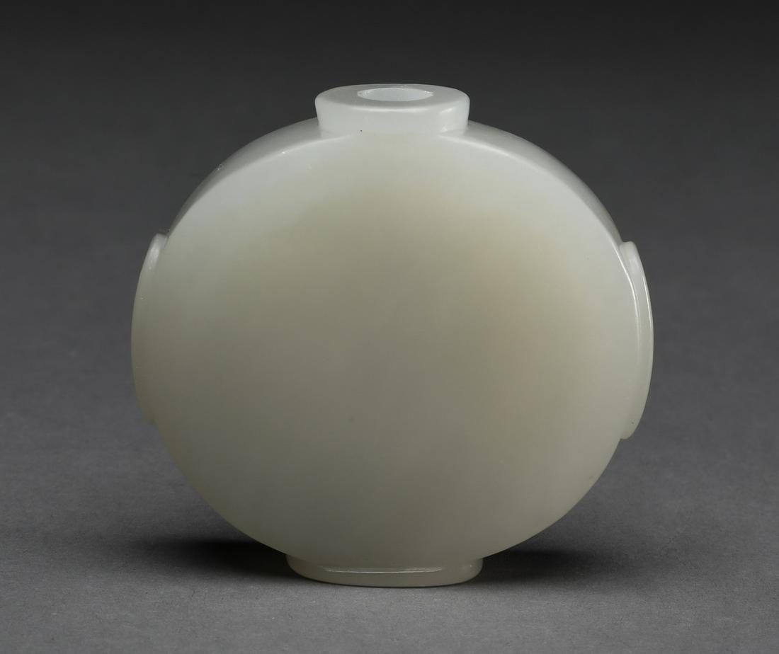 Chinese celadon jade moon flask snuff bottle: Chinese celadon jade snuff bottle, of moon flask form, flanked by raised oval handles and resting on an oval foot, 2"h x 2"w x.25"d.