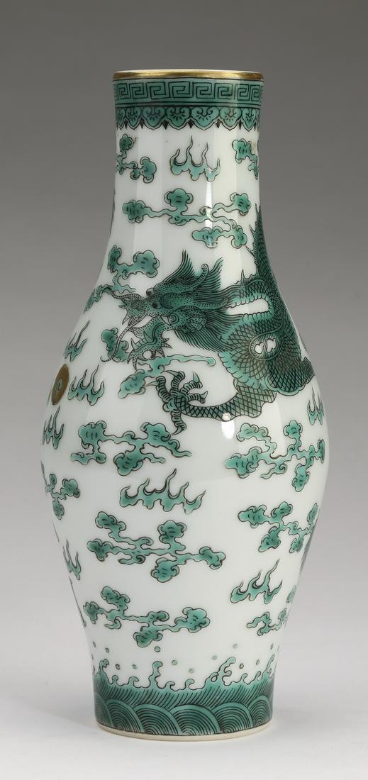Chinese famille verte dragon motif vase: Chinese famille verte dragon vase, of baluster form with leiwen and ruyi bands at the neck, above a body decorated with five clawed writhing dragons contesting a pearl of wisdom amidst auspicious clou