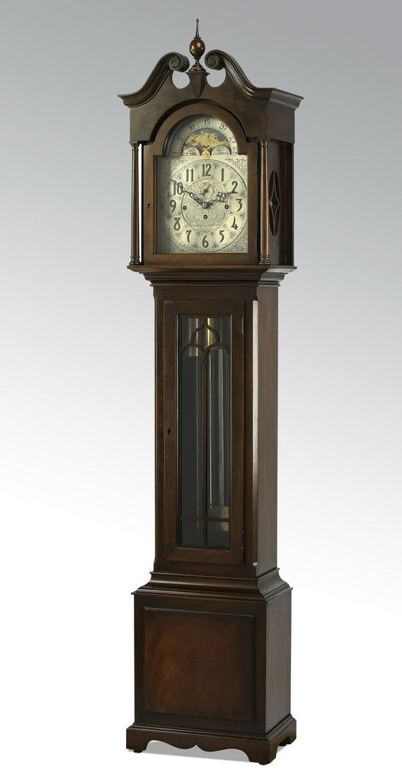 Early 20th c. Herschede five-tube tall case clock: Herschede tall case clock, having a double scroll pediment centering a turned finial, above the arched glass upper door opening to the moon dial, hour hand, and second hand in an etched metal face mar