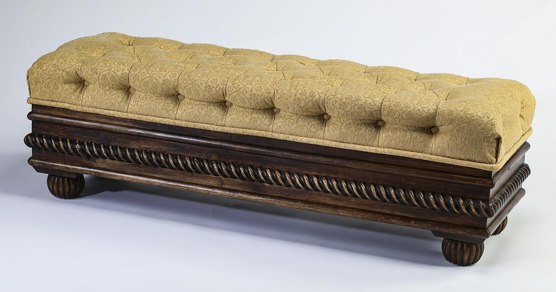 Button tufted upholstered bench with storage: Upholstered bench with storage, having a button tufted seat in gold Jacquard woven with an arabesque foliate pattern, opening to a generous storage compartment, above panels ornamented with a rope fri
