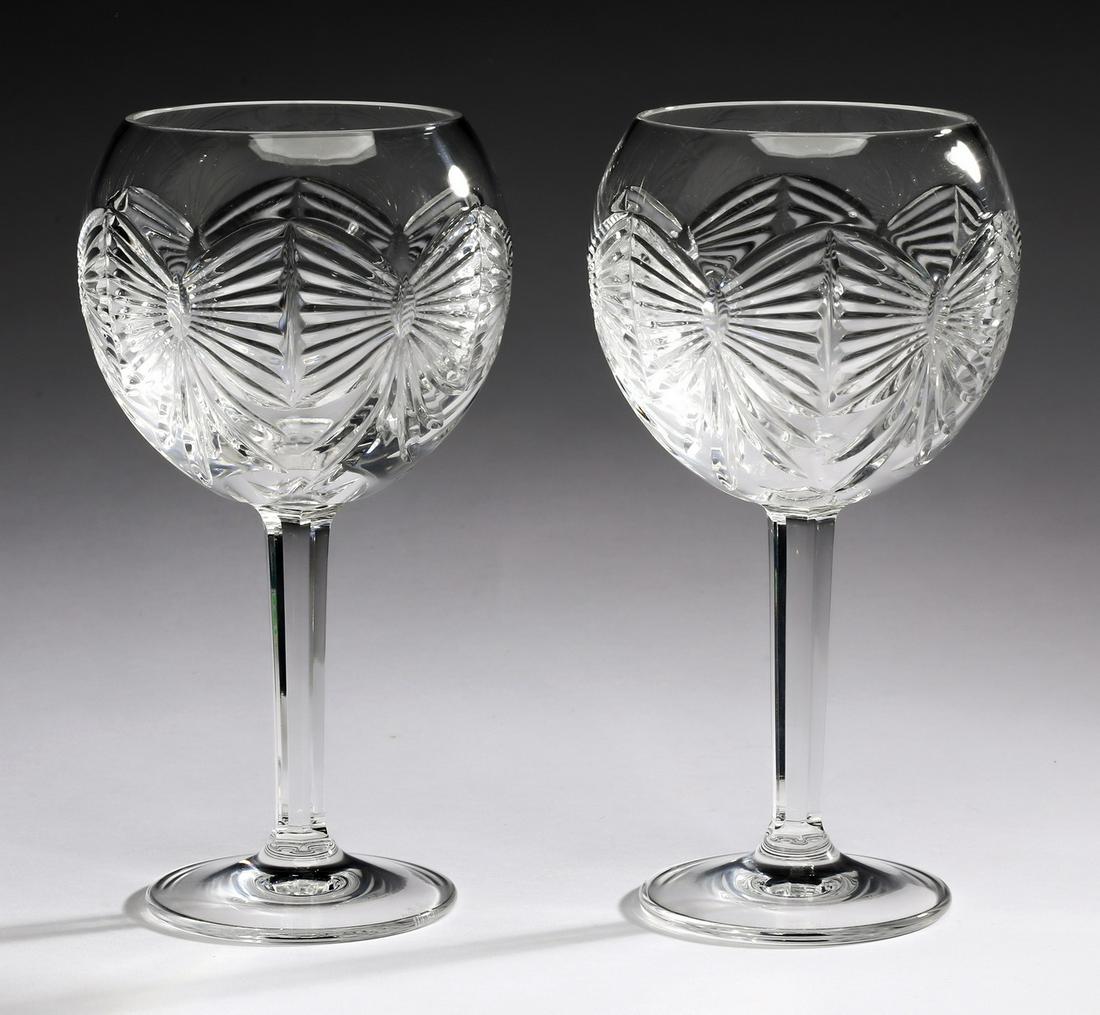 Pair of Waterford crystal wine glasses, 8"h: Pair of Waterford crystal wine glasses, each with cut bow motifs, marked 'Waterford' to vase, 8"h x 4"dia.