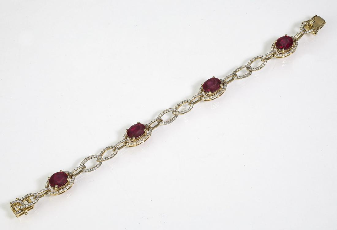 Ruby, diamond, and 14k yellow gold bracelet: Ruby, diamond, and 14k yellow gold bracelet, having four brilliant cut oval natural rubies weighing 16.64ctw, framed by round brilliant cut diamonds and interspaced with oval diamond lit links, having