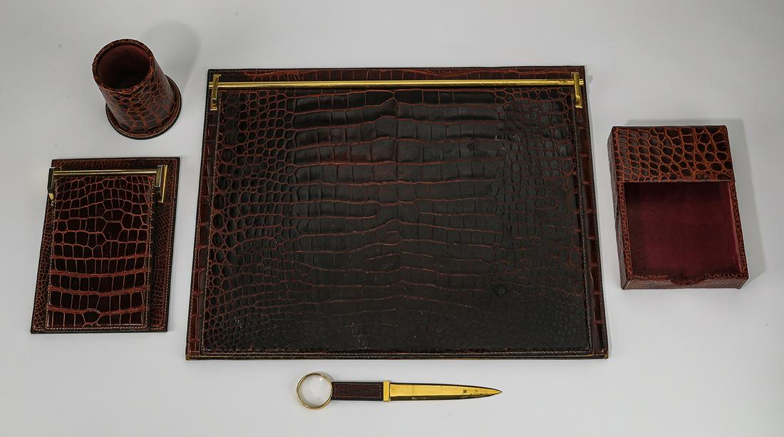 (5 pc.) Gucci genuine crocodile desk set: Gucci genuine crocodile (5) piece desk set comprised of: (1) large folio 1"h x 15.5"w x 20"d, (1) small folio 2"h x 9"w x 6.75"d, (1) notepad holder 1.75"h x 5.75"w x 8"d, (1) cup pen and pencil holde