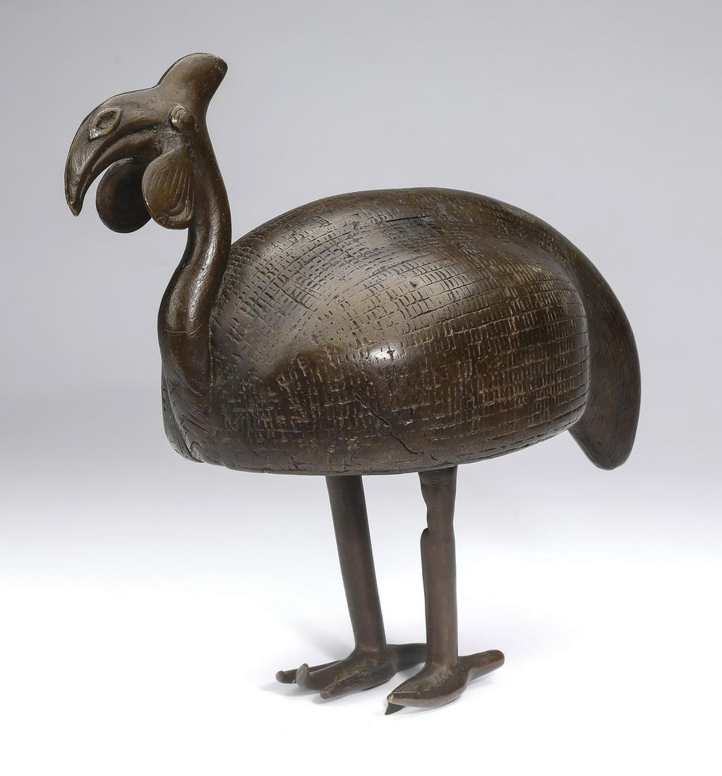 Benin style bronze guinea fowl, 11"h: Benin style bronze guinea fowl, Nigeria, 20th century, executed in the traditional style and depicted standing, 10.75"h x 11.5"l x 5.5"w.