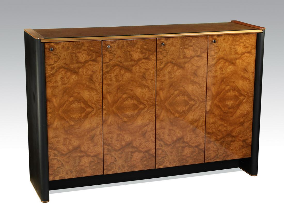 Italian bookmatched burl and ebonized cabinet, 82"w: Contemporary Italian burl and ebonized wood cabinet, having a rectangular burl top with a glass topper, a front knife edge and rounded corners, surmounting four locking bookmatched burl veneer doors o