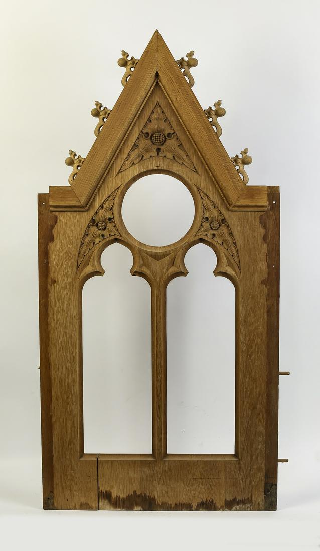 19th c. Gothic Revival architectural panel, 54"h: 19th century Continental Gothic Revival architectural panel, pierced and relief carved to resemble a Gothic window, 54"h x 26.75"w x 3"d.
