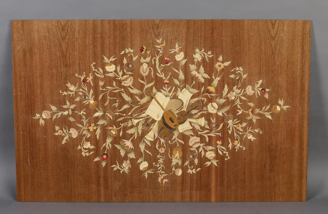 I(2) talian marquetry inlaid panels w/ musical trophy: Pair of Italian polychrome marquetry inlaid panels, depicting a musical trophy surrounded by a floral lozenge, unvarnished, 26.75"h x 43.25"w.