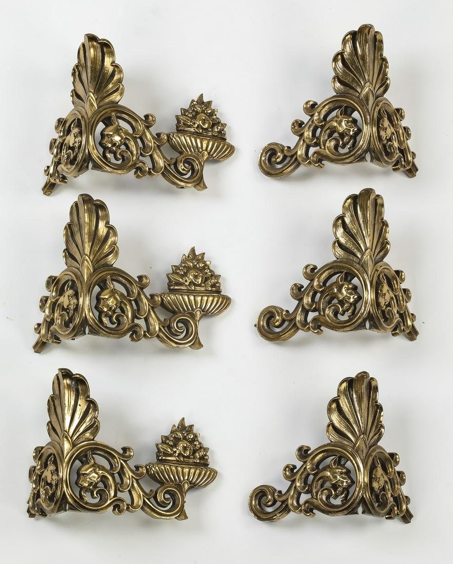 (6) Hinged bronze architectural elements, 6"h: Group of (6) bronze architectural elements, (3) hinged with a scallop cartouche flanked by acanthus scrollwork leading to floral arrangements, 5.75"h x 7.5"w x 5"d open, and (3) hinged with a scallop 
