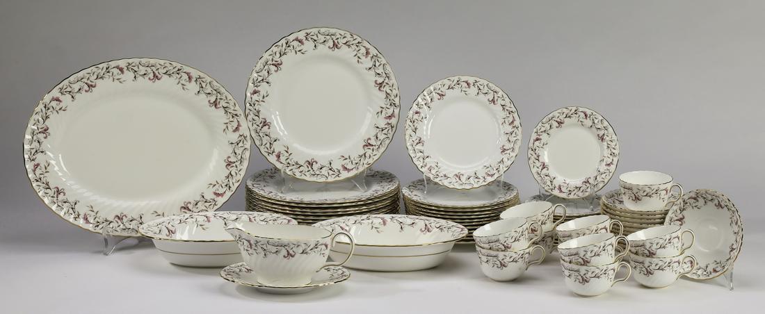 Minton table service for 12 in the 'Moorland' pattern: Porcelain table service for twelve in the 'Moorland' pattern by Minton, having ruffled rims decorated with twining floral vines accented in pink, comprising: (12) dinner plates, 10.5"dia; (12) salad p