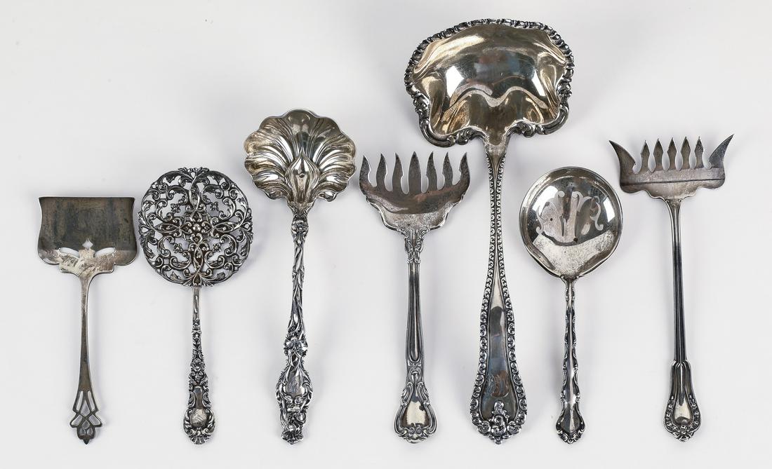 (7) Sterling serving pieces in the Baroque style: (7) Associated sterling serving pieces in Baroque style patterns, some with monograms, comprising: (1) Sterling Silver Manufacturing Company sardine server, 5.5"l; (1) Gorham sardine server, 5.25"l; (