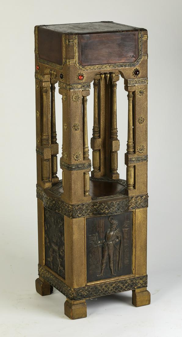 Venetian Gothic style pedestal with faux gemstones: Parcel gilt pedestal in the Venetian Gothic taste, having a square wooden plinth with faux metal trim ornamented with blue and red glass jewels, supported by four piers with detached gilt columns, ris
