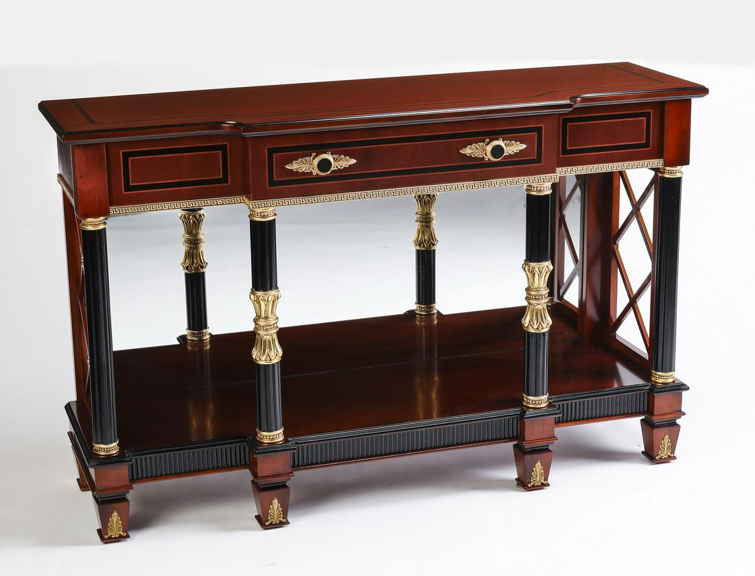 Parcel gilt and ebonized Regency style console table: Maitland-Smith style parcel gilt and ebonized Regency style console table, having an inlaid breakfront top over a frieze drawer, rising on four fluted and ornamented columns, fronting a mirrored back