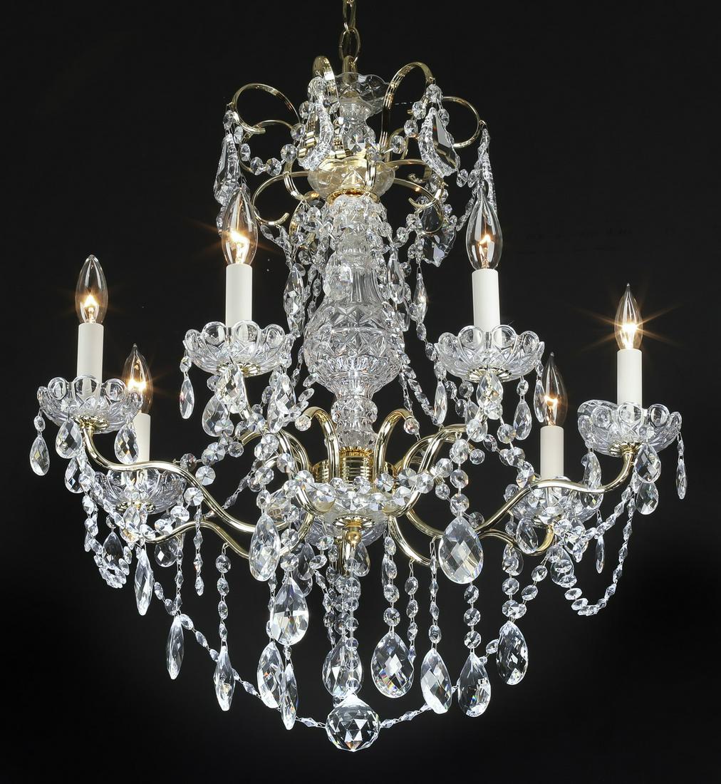 Schonbek crystal 7-light chandelier, 27"h: Schonbek crystal 7-light Louis XV style chandelier, having a crystal scalloped cup above ten scrolling arms hung with crystals swags and pendants, surmounting a crystal baluster form standard, issuing