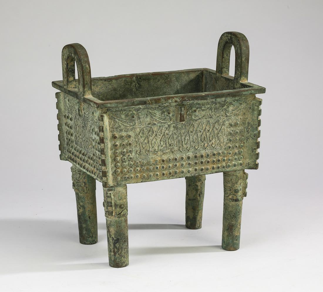 Western Zhou style Chinese bronze fangding, 10"h: Western Zhou style Chinese bronze fangding, the slightly tapering, deep rectangular body having a pair of inverted U-shaped handles on either side and decorated with reserves of repeating geometric de
