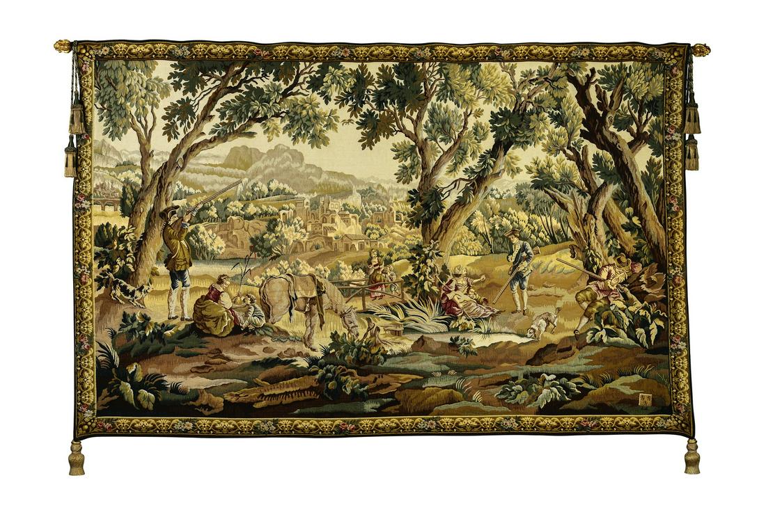 French Aubosson style wool tapestry, 110"w: Contemporary French machine woven wool and cotton tapestry in the Aubusson style, depicting a bucolic setting with noble hunters, their wives, and children enjoying leisure time in the forest, near a 