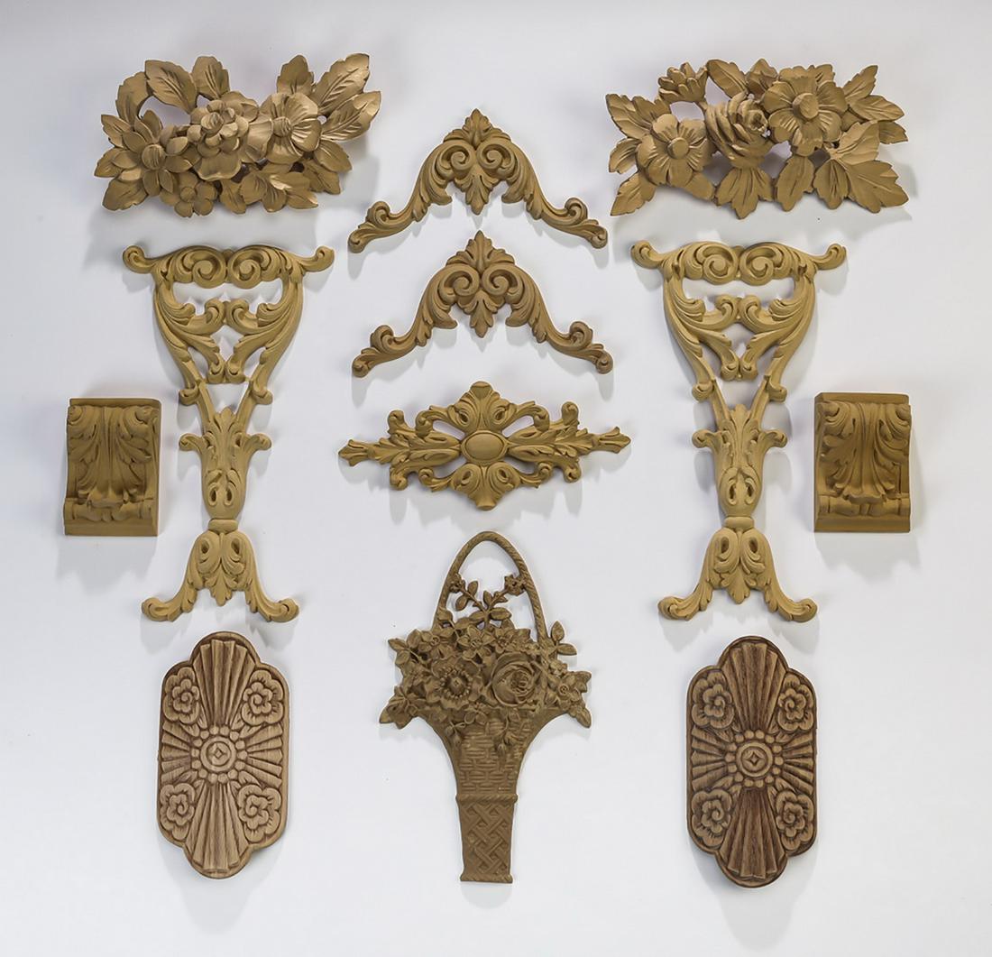 (12) Continental unfinished decorative appliques: Group of (12) unfinished decorative appliques, ready for your own stained or painted finish, including (2) English carved medallions, 6.75"h x 3.5"w, (1) cast floral basket, 9.5"h x 5.5"w, (2) carved 
