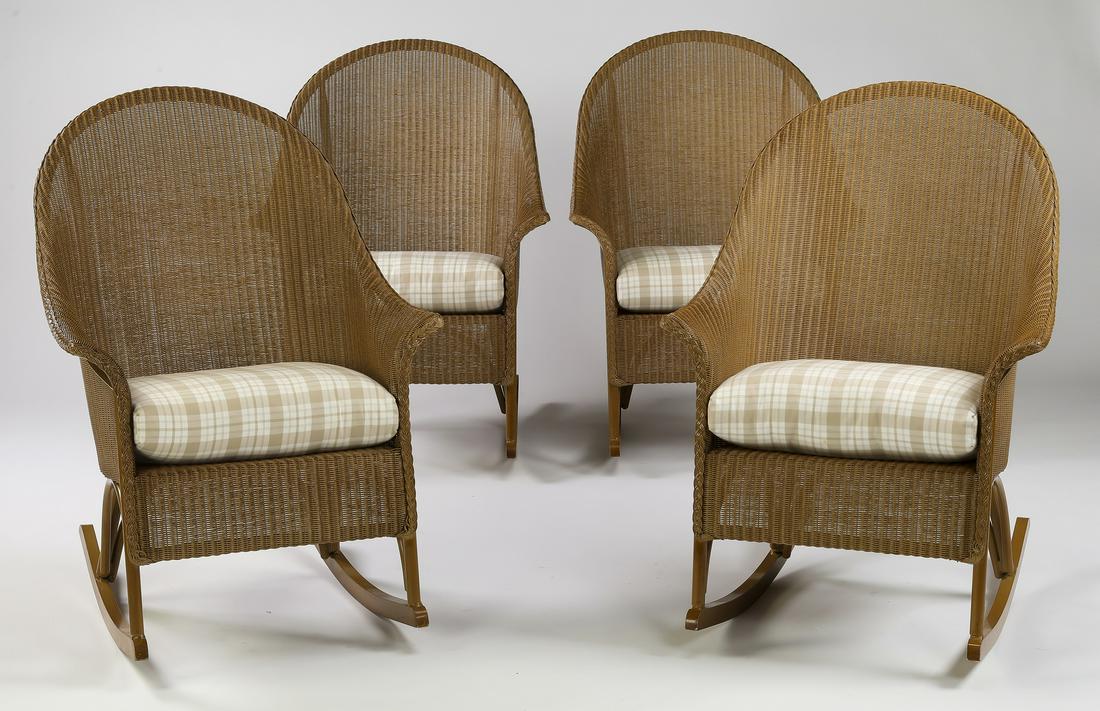 (4) Lloyd Flanders wicker outdoor rocking chairs: Group of (4) Lloyd Flanders wicker rocking chairs, each having a barrel back leading to flared arms, centering custom seat cushions in beige and taupe plaid, rising on four legs connected by rockers, 