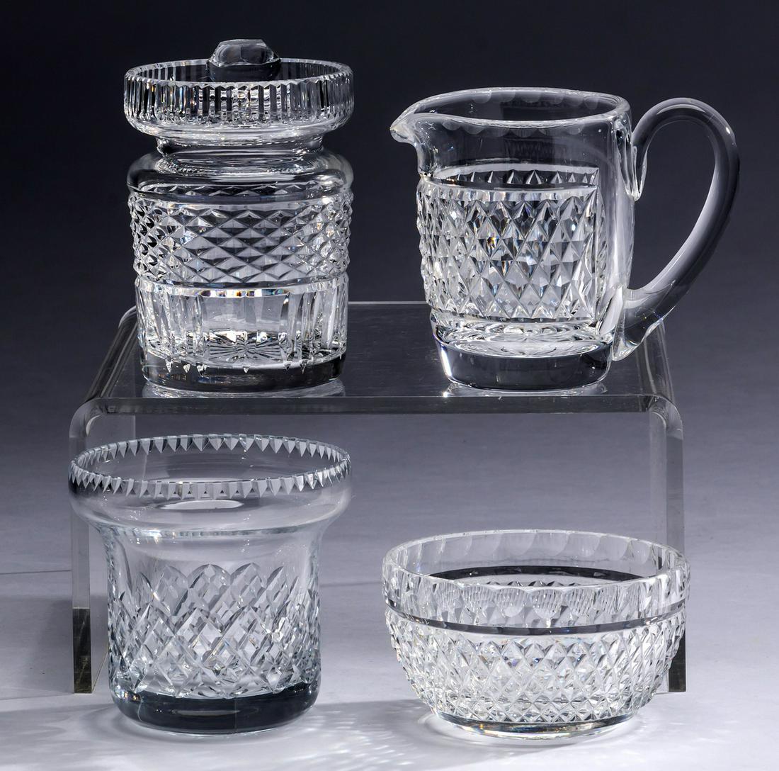 (4) Crystal table accessories including Waterford: Waterford crystal table accessories in the 'Alana' pattern, comprising: (1) jam pot; (1) creamer; and (1) sugar, each piece with a honeycomb etched pattern, marked Waterford underneath; together with