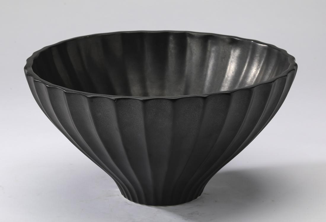 Jonathan Adler signed 'Lantern Bowl' in blackware: Jonathan Adler 'Lantern Bowl', executed in blackware, of circular form, having fluted details tapering from the rim to the base, marked and signed to underside, 5.5"h x 10.5"dia.