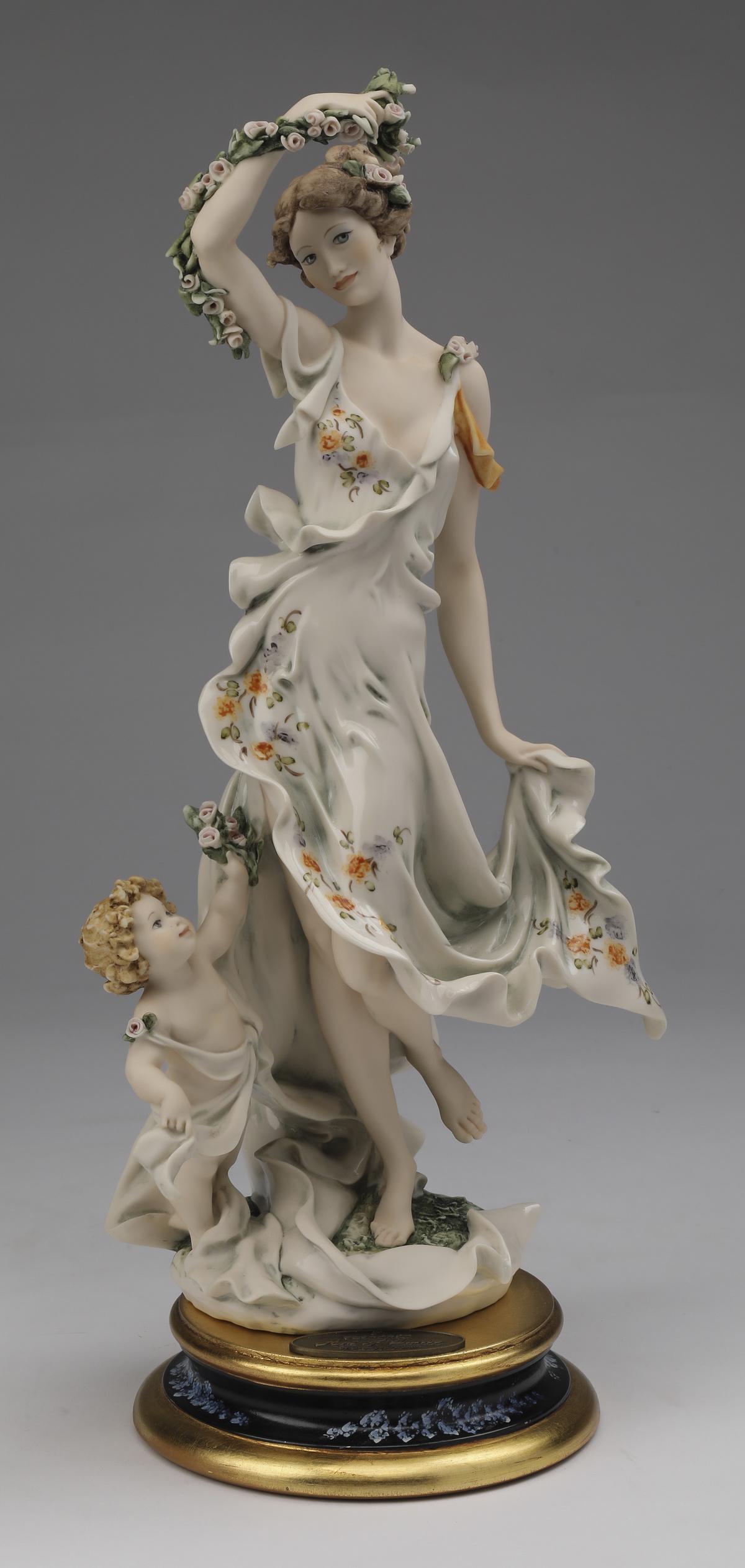 Giuseppe Armani limited edition, 'Art of Dance': Giuseppe Armani limited edition art sculpture, 'Art of Dance,' executed in composition material with hand painted detail, depicting a nymph gracefully holding a garland of flowers overhead and the hem