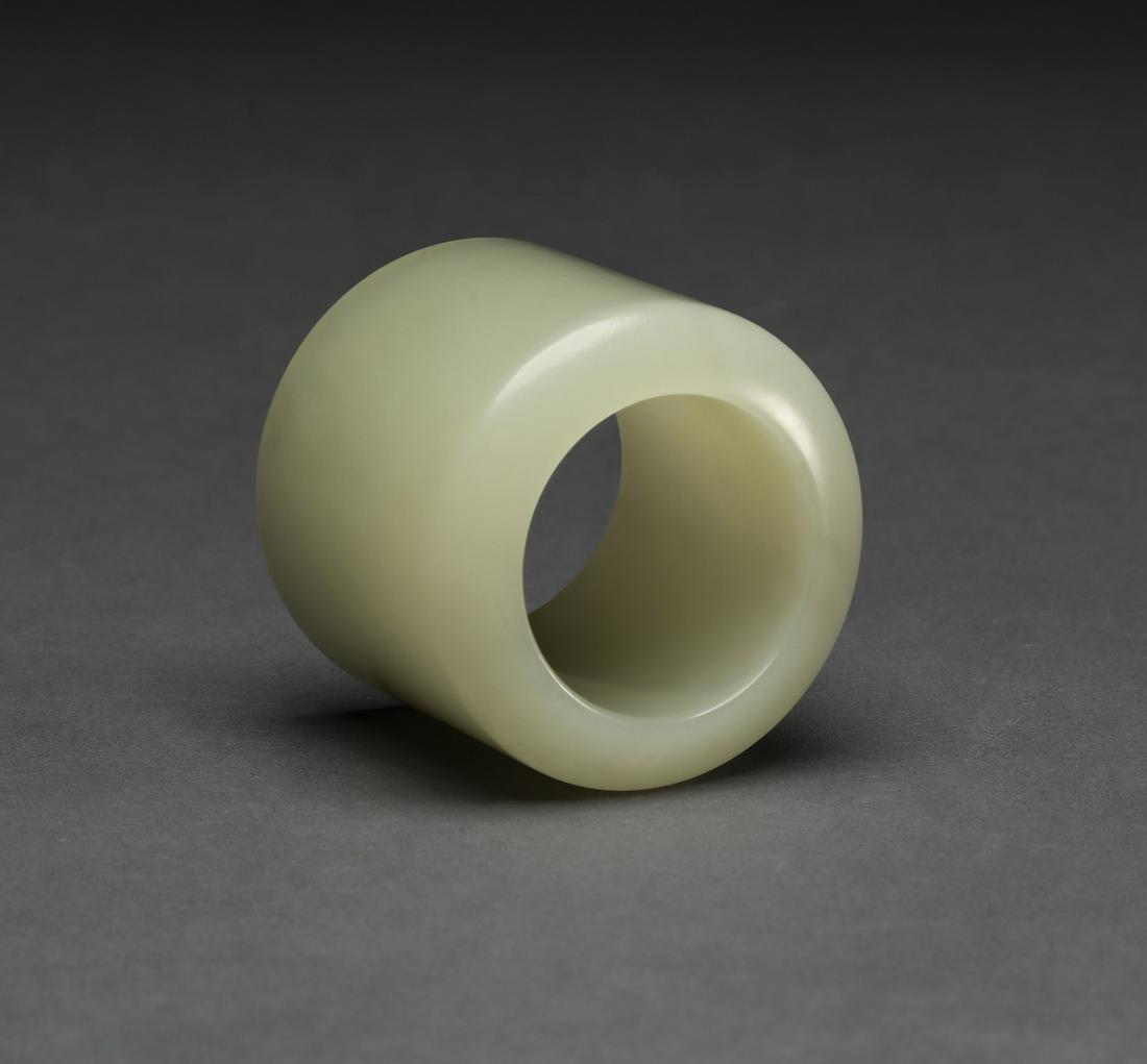 Chinese celadon jade archer's ring, 1.25"h: Chinese celadon jade archer's ring, of cylinder form, having a smooth exterior, 1.25"h x 1.33"w. Provenance: From the Private Collection of a distinguished Southern gentleman.