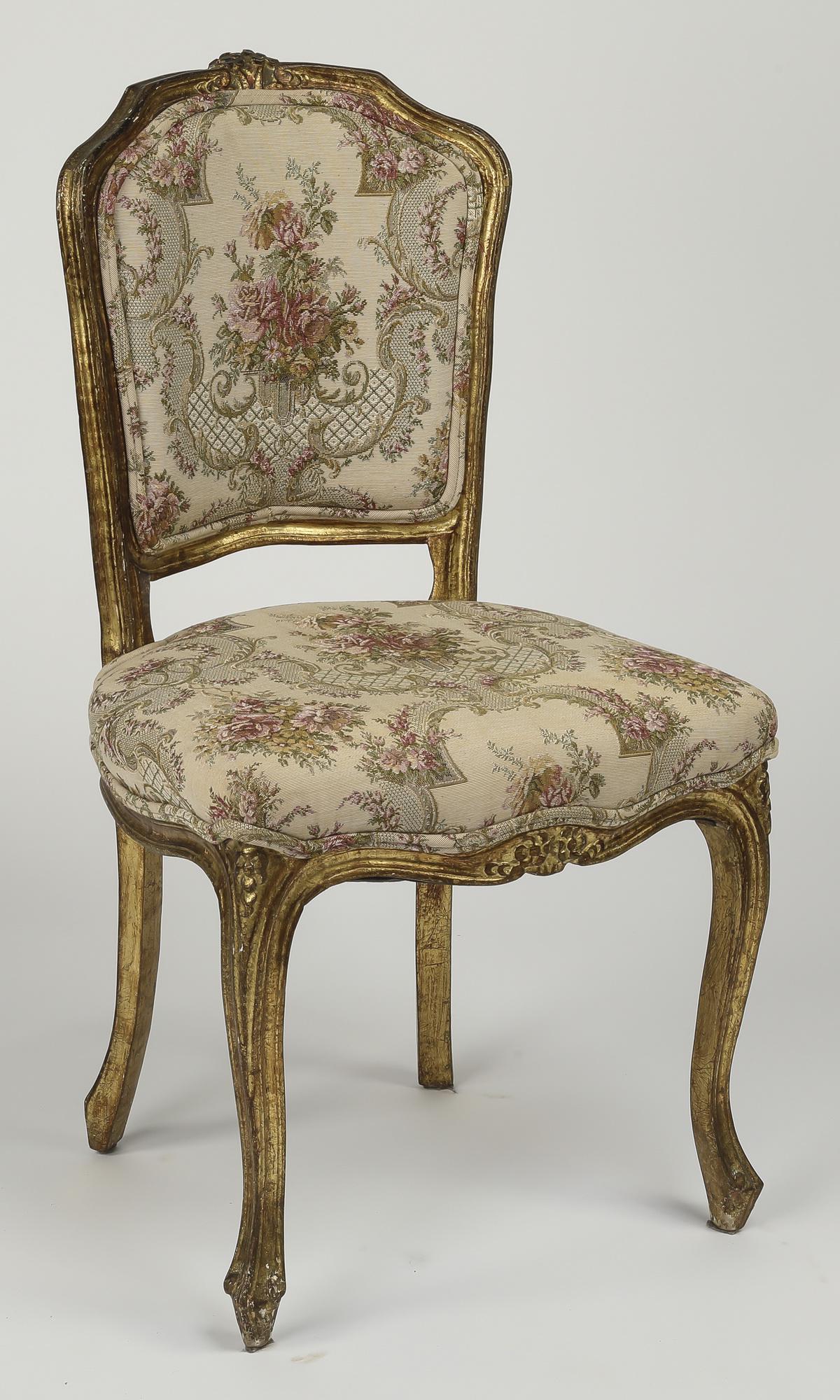 Early 20th c. Rococo Revival gilded side chair: Early 20th century Rococo Revival gilded side chair upholstered in foliate tapestry, having a shaped back and square seat, the whole rising on cabriole legs terminating in snake feet, 35"h x 19"w x 17