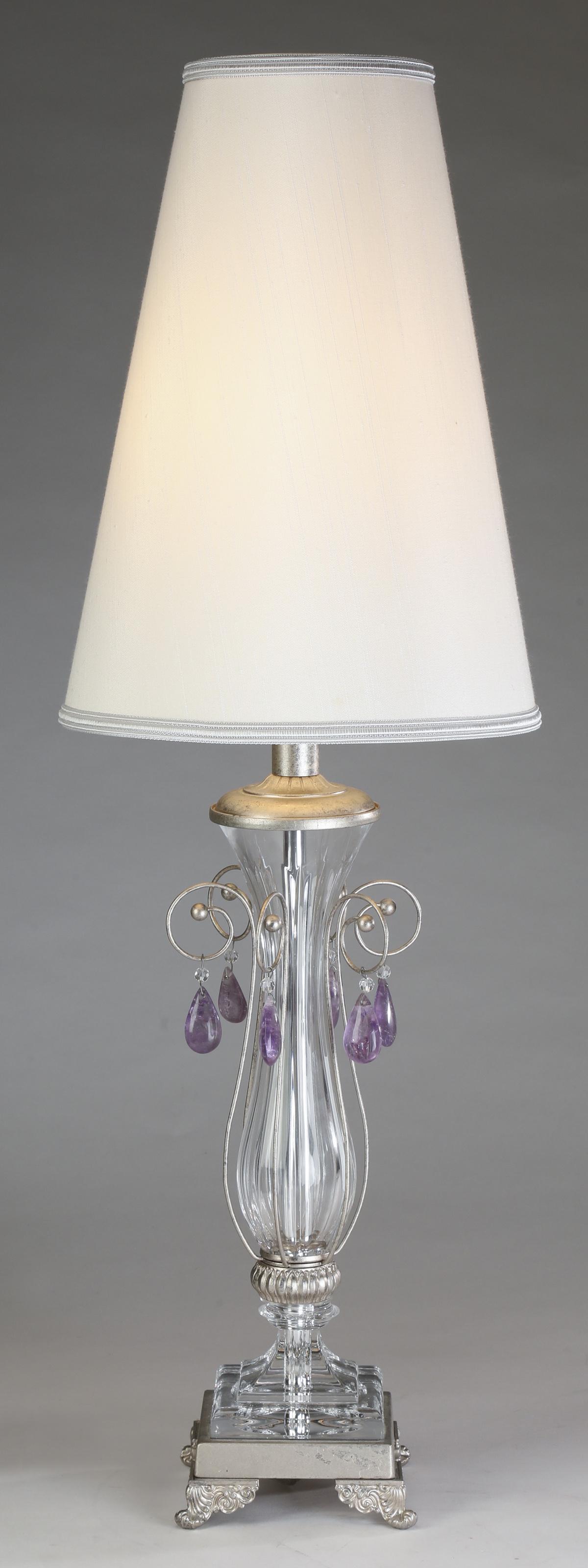 Contemporary glass table lamp w/ silk shade, 31"h: Contemporary glass table lamp, having a slender white silk shade, above a glass baluster form base, encompassed in silvered scrolls each hung with a lavender quartz crystal pendant, the whole resting 