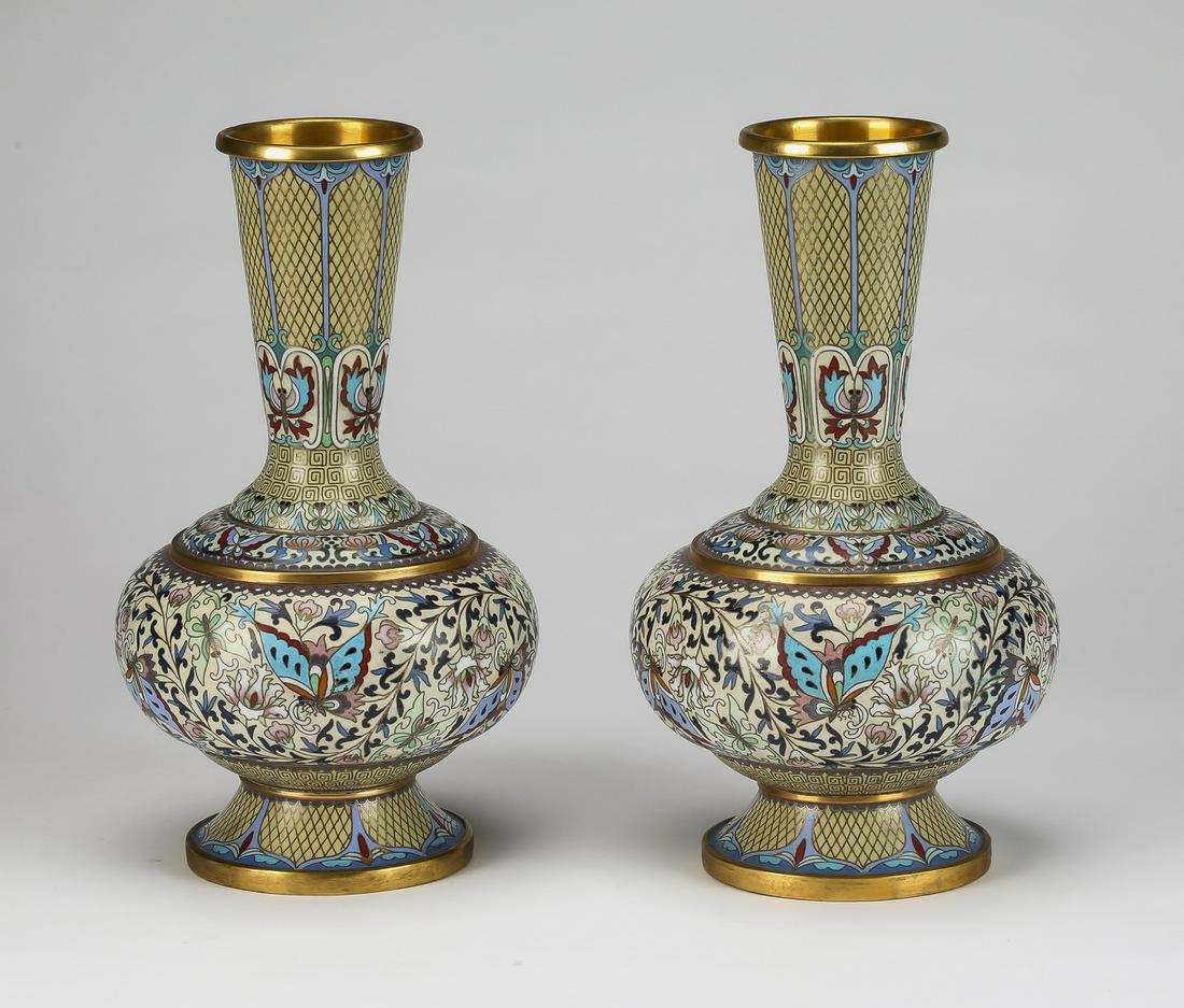 (2) Chinese cloisonne vases, One Hundred Butterflies: Pair of cloisonne vases in the Moorish taste, each having a trumpet shaped neck over a compressed globular body rising on an outswept foot, depicting the 'One Hundred Butterflies' motif and ornamented