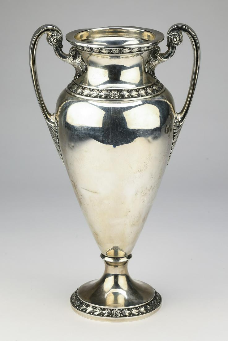 Gorham sterling silver classical style urn, 11"h: Gorham sterling silver urn in the classical taste, having a traditional amphora shape with bellflower bands on the rim, shoulder, and foot, marked 'Sterling A10064 2½ Pint,’ 11"h x 6.5"w x 4.5"d, 5