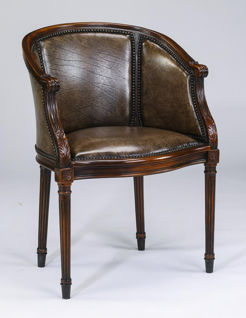Mahogany Regency style bergere: Mahogany bergere in the Regency taste, 20th century, having a molded crest rail on a U-shaped back, extending to arms rising on reeded and acanthus carved supports, upholstered in faux leather with br